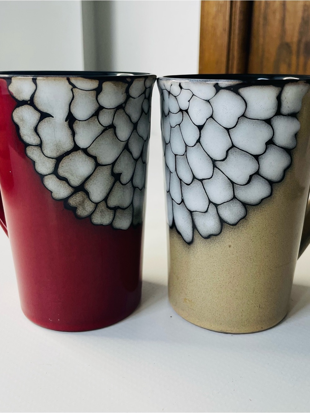 Ceramic Pair: Red and Tan Mugs with White Petal Detail